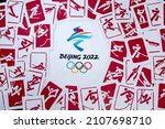 Small photo of BEIJING, CHINA, JANUARY 1, 2022: Background for winter olympic game in Beijing, China, 2022. Red pictogram of all sports in background