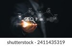 Small photo of Businessman hold virtual SEO icon to analyze SEO search engine optimization for promoting ranking traffic on website and optimizing your website to rank in search engines.