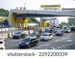 Small photo of Semarang, Indonesia - April, 2023 : The situation of homecoming and backflow trips during the Idul Fitri holiday can be seen at the toll road gates of the city of Semarang. The Trans Java Toll Road.