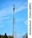 Small photo of Telecommunication tower with wireless communication antenna transmitter against blue sky. Internet, 3G, 4G and 5G cellular connection.