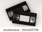 Two Old Videotapes On A White...
