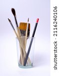 paint brushes in a glass on... | Shutterstock . vector #2116240106