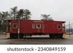 Small photo of Old caboose on old section of railroad track now abandoned store