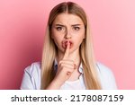 Photo of young pretty lady cover lips finger shh keep secret shut up isolated over pink color background