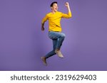 Small photo of Full-length portrait of crazy excited handsome man jumping up runner fast sale isolated on shine background.