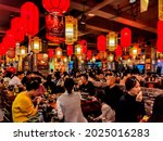 Small photo of Chengdu, China - November 19th 2019: Bustling Sichuan Hotpot Restaurant with red Lanterns