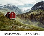 Wooden cottage in the valley. Flowers. Stone snowy mountains. Stalheim, Norway. Fog. Vintage
