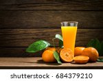 Still Life Glass of Fresh Orange Juice on Vintage Wood Table with Copy Space Background