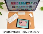 NFT on a digital tablet on a desk illustration of a pig