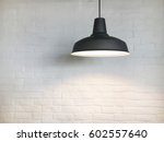 Black fixture and white brick wall.