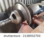 Small photo of Resurfacing a brake disk rotor. Brake disc lathe easy and effectively reconditions all kind of brake discs or rotors.