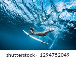 Surfer woman with surfboard...