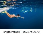 Young Woman Swim Underwater...