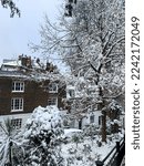 Small photo of London, UK - 12.12.2022. Holly Hill street view, Hampstead. Winter in London, snow, snowing. Hampstead is an affluent residential area favoured by academics, artists and media figures