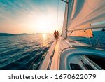 Young Couple Enjoys Sailing In...