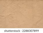 Old traditional house wall texture. Brown beige sandy color rough plaster background.
