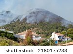 Small photo of Fire dangerously approaching homes in Pinos de Alhaurin. Forest fire in the Sierra de Mijas in Malaga, Spain.