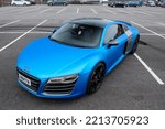 Small photo of United Kingdom, Manchester March 2021. A Satin Blue Vinyl Wrapped 2010 Audi R8 Supercar With Gloss Black Alloy Wheels