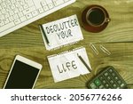 Small photo of Inspiration showing sign Declutter Your Life. Business idea To eliminate extraneous things or information in life Display of Different Color Sticker Notes Arranged On flatlay Lay Background
