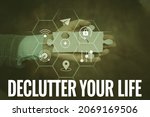 Small photo of Text caption presenting Declutter Your Life. Internet Concept To eliminate extraneous things or information in life Hand Holding Jigsaw Puzzle Piece Unlocking New Futuristic Technologies.