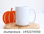 Small photo of White Coffee Mug 15oz with pumpkin Decor Mock Up. Halloween mug muck up
