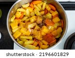 Small photo of Vegetables for pumpkin soup are fried and languished in a saucepan