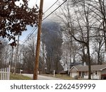 EAST PALESTINE, OH - Circa Feb 2023: The rising smoke cloud after authorities released chemicals from a train derailment as seen from the ground in a nearby neighborhood. Photo credit: RJ Bobin.