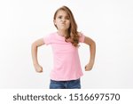 Small photo of Strong brave cute little girl child acting mature and strong, showing power and ability stand for herself, pouting serious grimace, raise hands clench fists brag muscles and biceps, can fight back