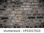 Weathered texture of stained old dark brown and red brick wall background, grungy rusty blocks of stone-work technology, colorful horizontal architecture