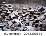 The texture of large stones with snow. Background of cobblestones. High quality photo