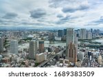 Tokyo business district cityscape with commercial and residential skyscrapers. Asian capital city drone view 