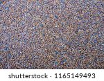 Small photo of Floor coating composed of small pebbles agglutinated. Pebble floor decorative coating.