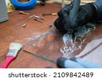 Small photo of A craftsman does glass engraving with a rotary tool
