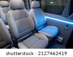 comfortable passenger bus interior with upholstered seats
