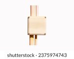 Small photo of Box small plastic wiring with pipe yellow isolated on white background. Cables on Wires are secured with plastic ties. Conducting wiring. Electrical installation works. Electrical safety concept.