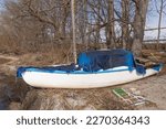 A Covered Boat On The Shore In...