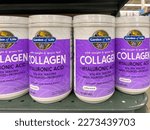 Small photo of Pearland, TX, USA - March 10, 2022: Garden of Life Marine and Grass-Fed Collagen Peptides Powder Supplement, Unflavored, 20g per Serving, 9.52 Oz jars on the shelf at a grocery store.