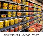 Small photo of Pearland, TX, USA - March 10, 2022: Fresh cut fruit and vegetables in the boxes or bowls on the shelves in a supermarket.
