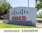 Small photo of Cisco sign at the headquarters in San Jose, California, USA - June 11, 2023. Cisco Systems, Inc., is an American-based multinational digital communications technology conglomerate corporation.