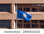 Small photo of The flag of the state of Connecticut at the State of Connecticut government office building in Hartford, CT, United States, on November 8, 2023.