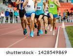group of athletes runners middle distance running of competition in athletics