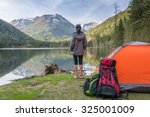 Camp in the mountains near of the lake. Bivouac on the lake in the Alps
