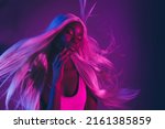 Small photo of Picture of alluring tempting female seducing man in nightclub touch face isolated on violet fluorescent background