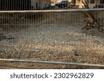 Small photo of Barbed wire fence symbolizes boundaries, security, and deterrence. It represents the division between spaces, protection, and acts as a visual deterrent to unauthorized entry