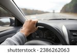 Small photo of hands gripping a steering wheel, symbolizing control, focus, and safety while driving