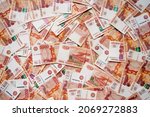 Small photo of five thousandth money bills of Russian rubles with Khabarovsk are laid out on the table