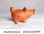 Toy sculpture of a pig on a...