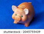 A Small Toy Sculpture Of A Pig...