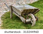 Old Wooden Wheelbarrow On Grass ...