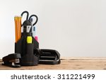 Stationery on wooden table on a gray background, closeup. Copy space. Free space for text
